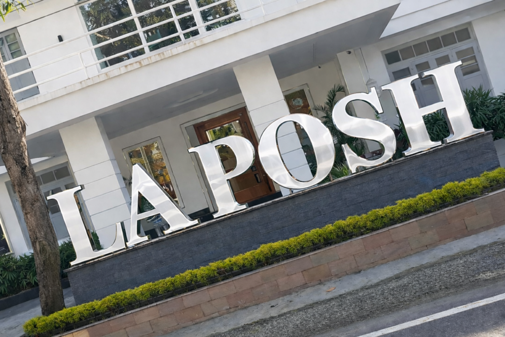 Premium stainless steel letter signage installed at La Posh property entrance, featuring large 3D metallic letters for elegant brand visibility and architectural appeal.